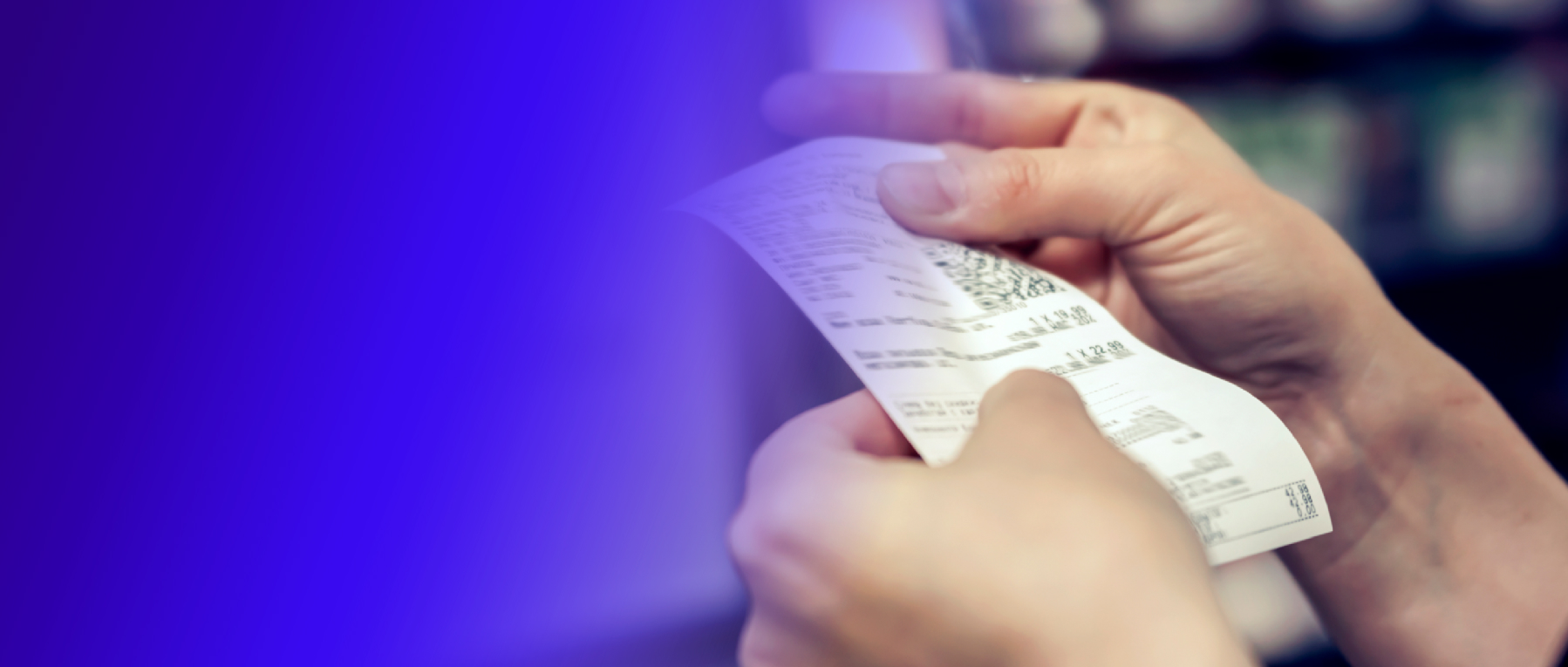 Close up on the hands of two people. One handing a paysafecard to the other.